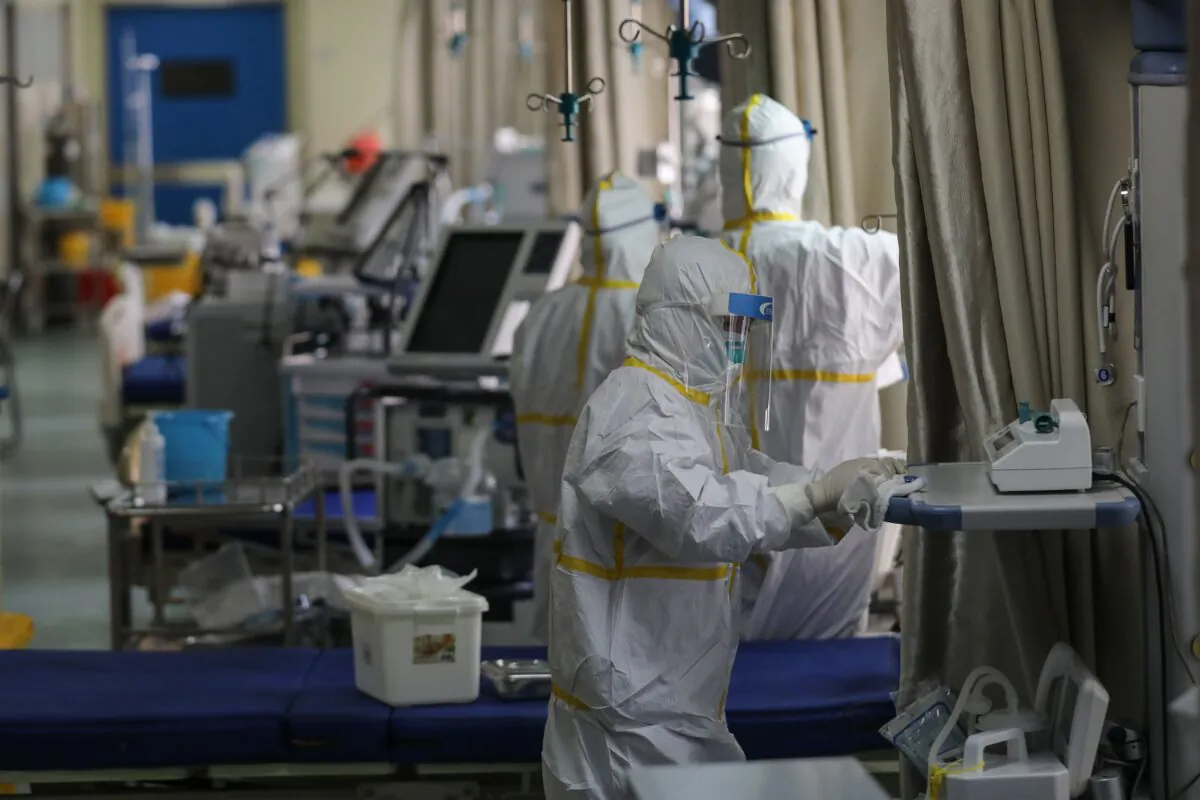 Medical staff members disinfect equipment at a ward used to be an isolation ward for patients infected by the COVID-19 coronavirus at a hospital in Wuhan, China on March 12, 2020. (STR/AFP via Getty Images)