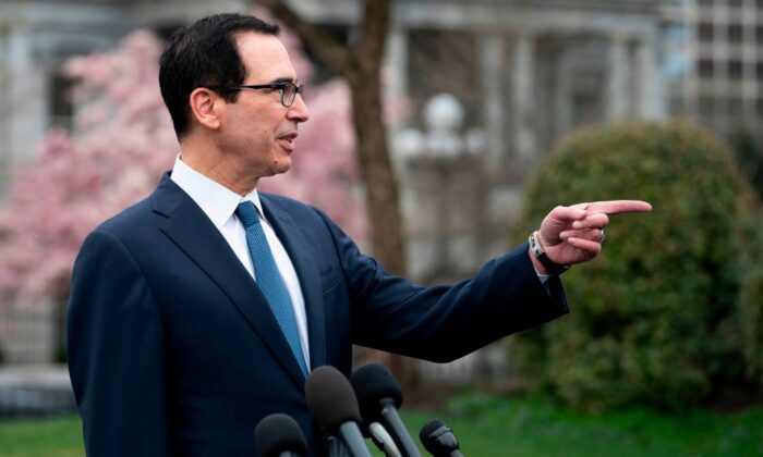 Treasury Secretary Steven Mnuchin speaks with reporters outside the White House on March 13, 2020. (Jim Watson/AFP/Getty Images)