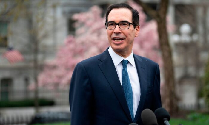 Treasury Secretary Steven Mnuchin speaks with reporters outside White House in Washington, DC, on March 13, 2020. (Jim Watson/AFP/Getty Images)
