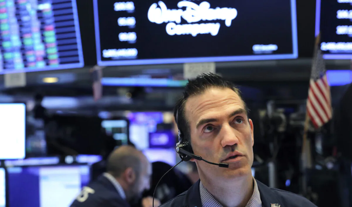 A trader works on the floor of the New York Stock Exchange (NYSE) after the opening bell of the trading session in New York, on March 13, 2020. (Reuters/Lucas Jackson)