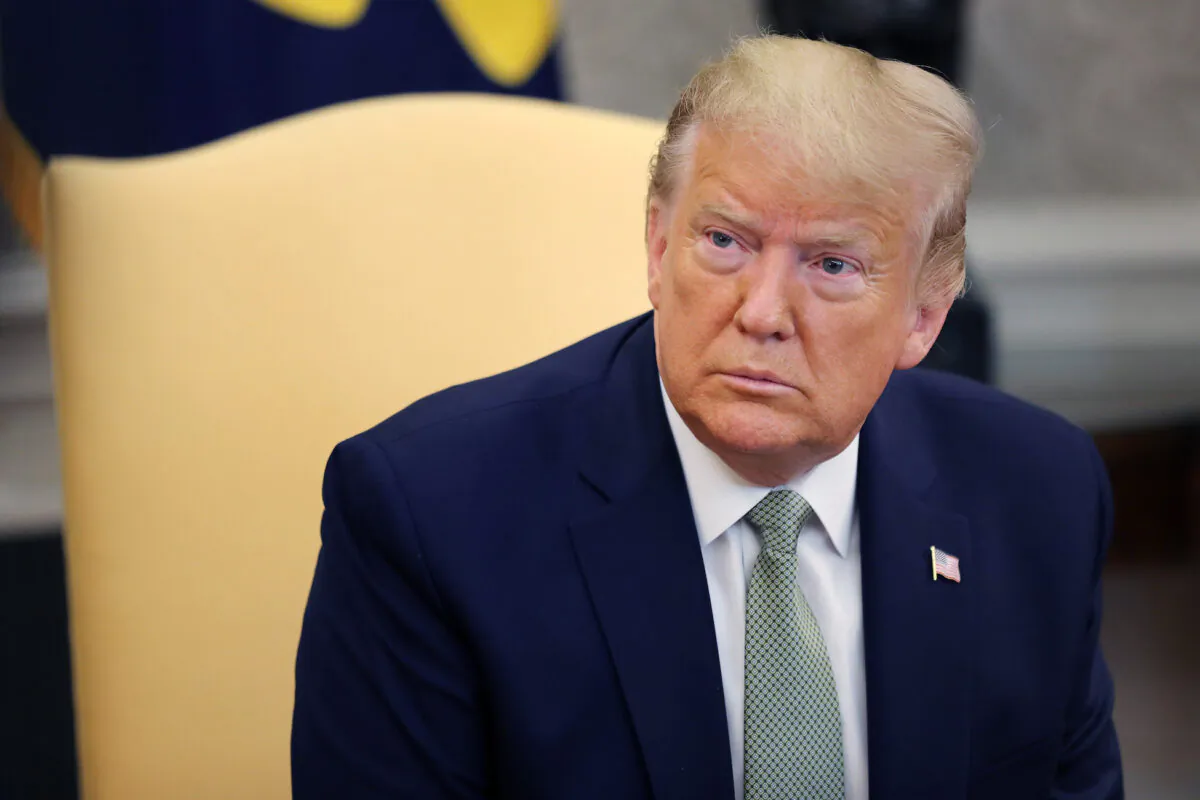 President Donald Trump talks to journalists in the Oval Office at the White House on March 12, 2020. (Chip Somodevilla/Getty Images)