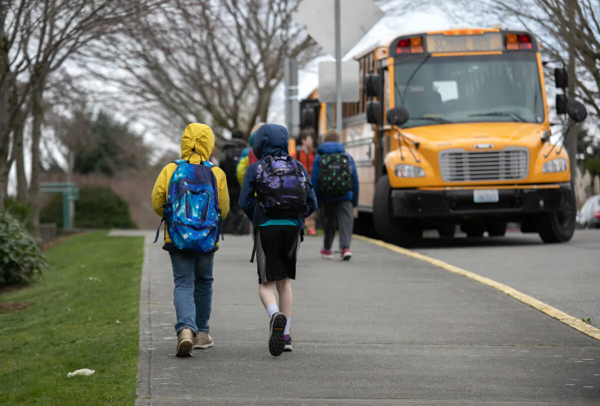 Students leave the Thurgood Marshal Elementary school after the Seattle Public School system was abruptly closed due to CCP virus fears in Seattle, Washington, on March 11, 2020. (John Moore/Getty Images)