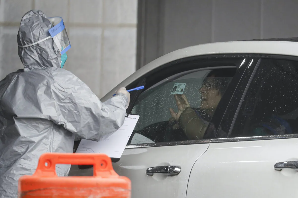 A patient arrives to be tested for COVID-19 at Glen Island Park in New Rochelle, N.Y. on Friday, March 13, 2020. (John Minchillo/AP Photo)