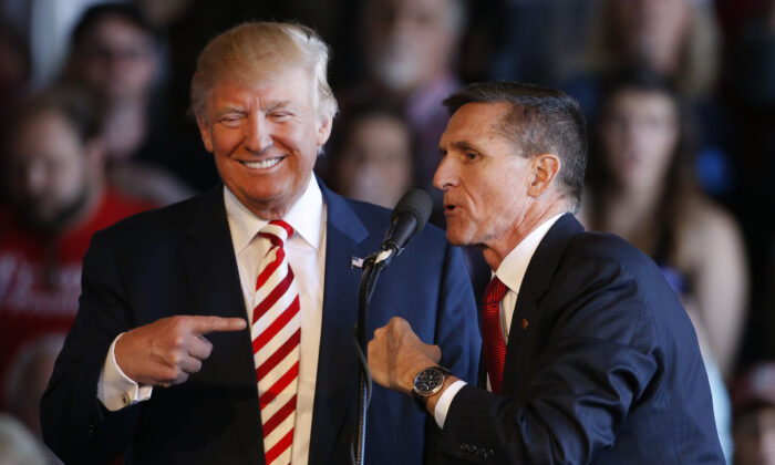 Republican presidential candidate Donald Trump (L) jokes with retired Gen. Michael Flynn at a rally at Grand Junction Regional Airport in Grand Junction, Colo., on Oct. 18, 2016. (George Frey/Getty Images)