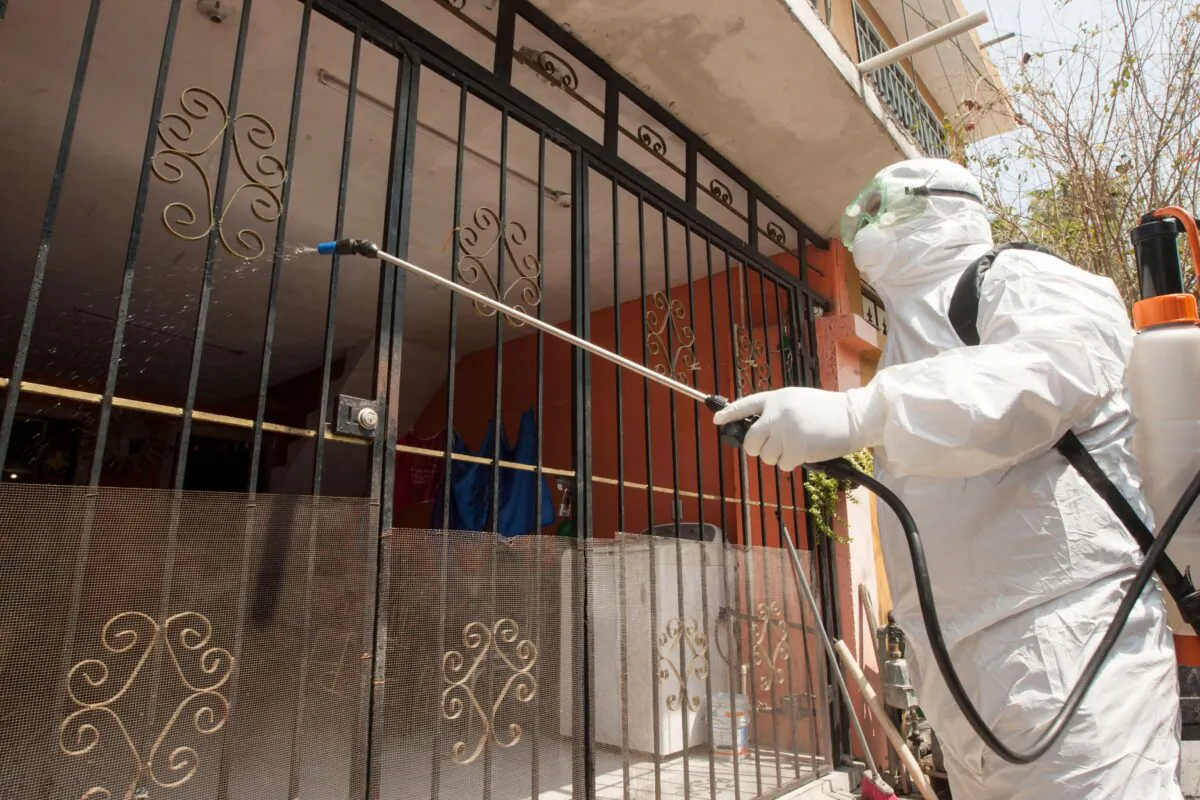 A paramedic from Escobedo, disinfects a house during a coronavirus drill, in Escobedo Nuevo Leon, Mexico, on March 15, 2020. (Julio Cesar Aguilar/AFP via Getty Images)