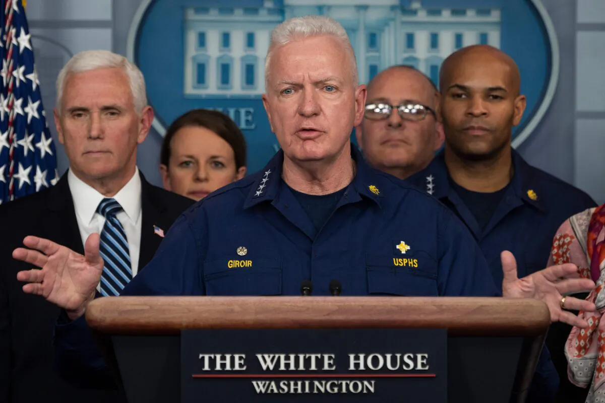 Assistant Secretary for Health and head of the Public Health Service Admiral Brett Giroir standing with Vice President Mike Pence (L) and members of the White House Coronavirus Task Force team, at the White House in Washington on March 15, 2020. (Jim Watson/AFP via Getty Images)