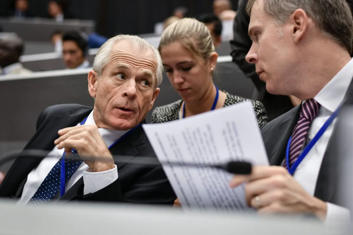 White House trade adviser Peter Navarro (L) attends the opening session of a congress of the Universal Postal Union (UPU) in Geneva on Sept. 24, 2019. (FABRICE COFFRINI/AFP via Getty Images)