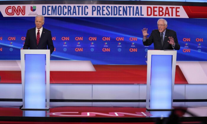 Former Vice President Joe Biden (L) and Sen. Bernie Sanders (I-Vt.) participate in a Democratic presidential primary debate at CNN Studios in Washington on March 15, 2020. (Evan Vucci/AP Photo)