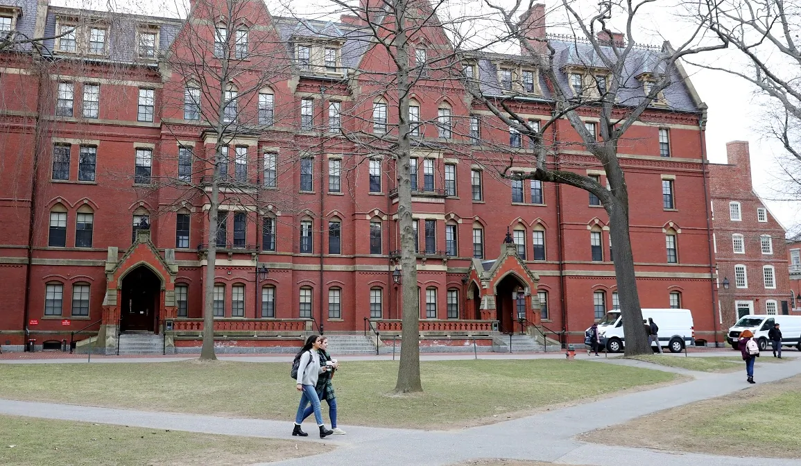 Students walk through Harvard Yard on the campus of Harvard University in Cambridge, Mass., on March 12, 2020. (Maddie Meyer/Getty Images)
