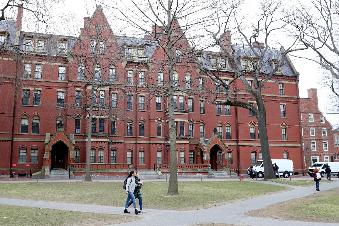 Students walk through Harvard Yard on the campus of Harvard University in Cambridge, Mass., on March 12, 2020. (Maddie Meyer/Getty Images)