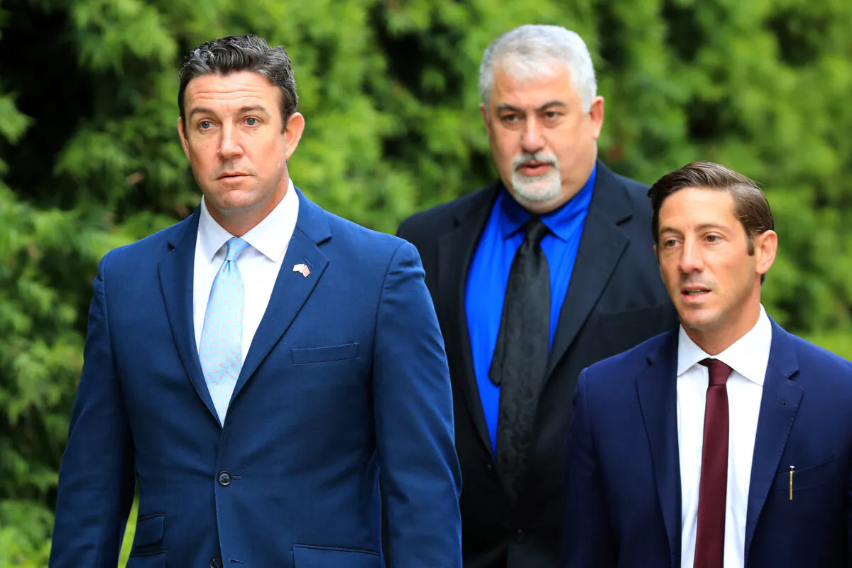 Former Rep. Duncan Hunter (R-Calif.) (L) walks into the Edward J. Edward J. Schwartz Federal Courthouse to be sentenced on corruption charges in San Diego, Calif., on March 17, 2020. (Sean M. Haffey/Getty Images)