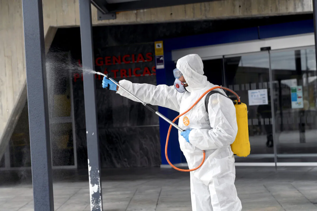 A member of the Military Emergency Unit disinfects the Central University Hospital of Asturias during a 15-day state of emergency declared to combat the outbreak of the coronavirus in Oviedo, Spain, on March 17, 2020. (Eloy Alonso/Reuters)