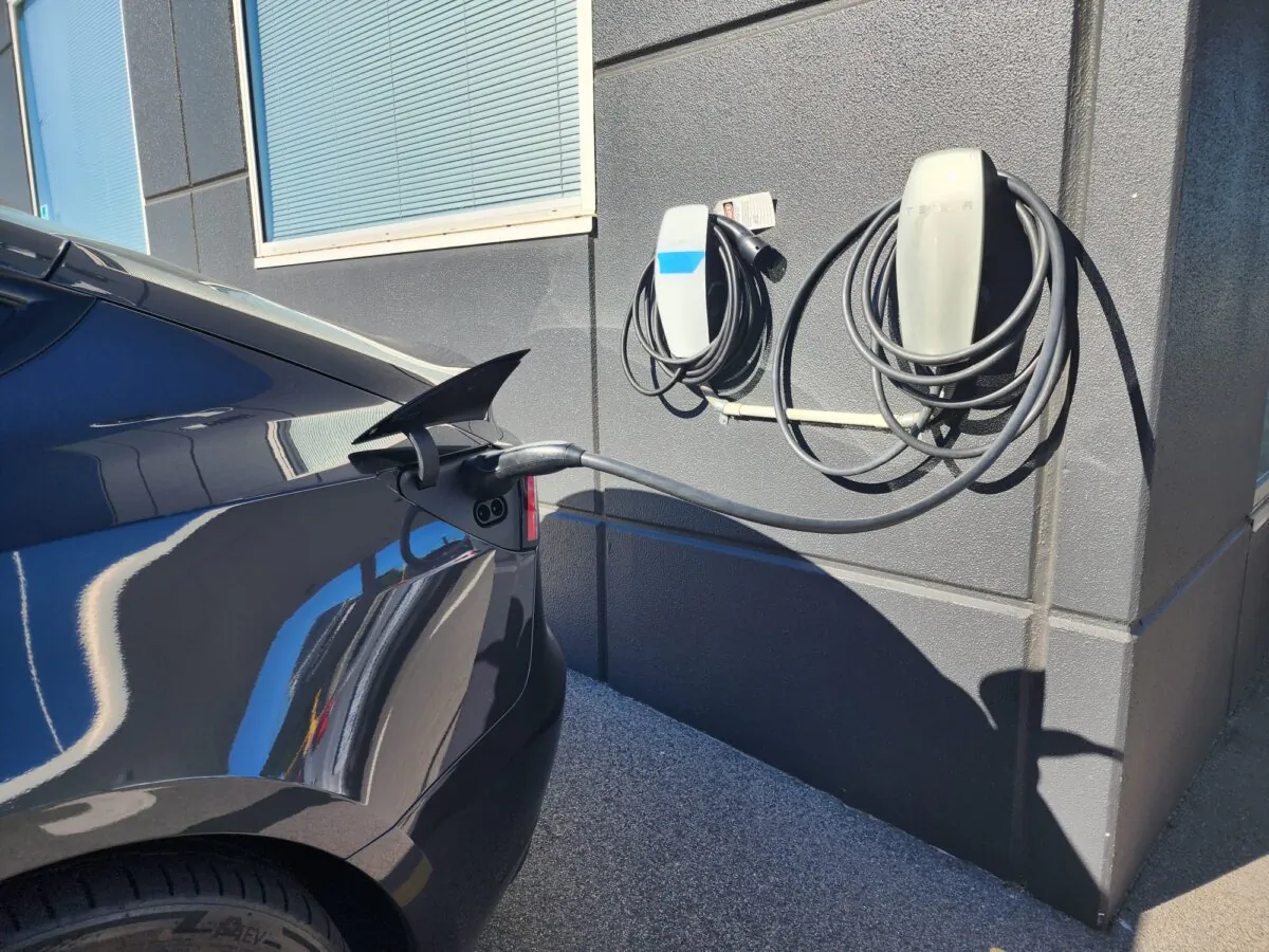 A Tesla EV is being recharged at a dealership in Perth, Western Australia, on March 16, 2024. (Susan Mortimer/The Epoch Times)