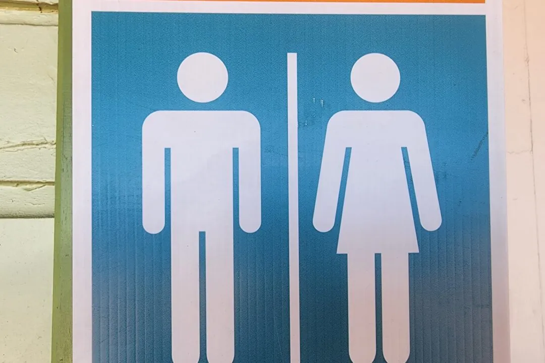 Symbols indicating male and female bathrooms are seen in Perth, Australia, on March 16, 2024. (Susan Mortimer/The Epoch Times)