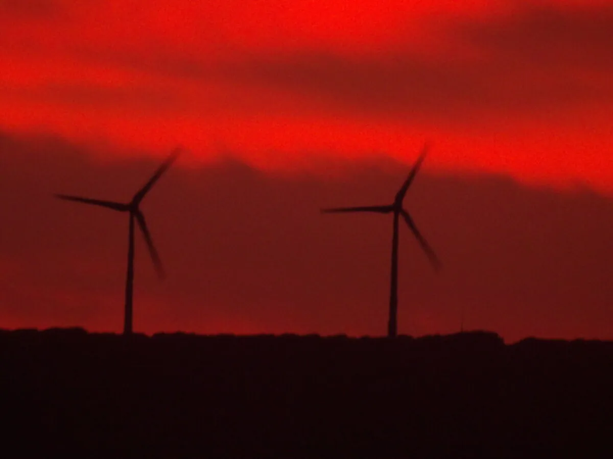Two wind turbines are seen in Albany, Western Australia, on April 5, 2024. (Susan Mortimer/The Epoch Times)