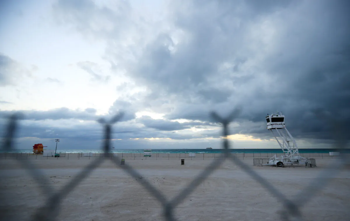 A mobile police tower overlooks an area of South Beach that the city closed in an effort to prevent the spread of the coronavirus in Miami Beach, Florida on March 17, 2020. Miami Beach city officials closed the area of the beach that is popular with college spring breakers and asked them to refrain from large gatherings where COVID-19 could spread. (Cliff Hawkins/Getty Images)
