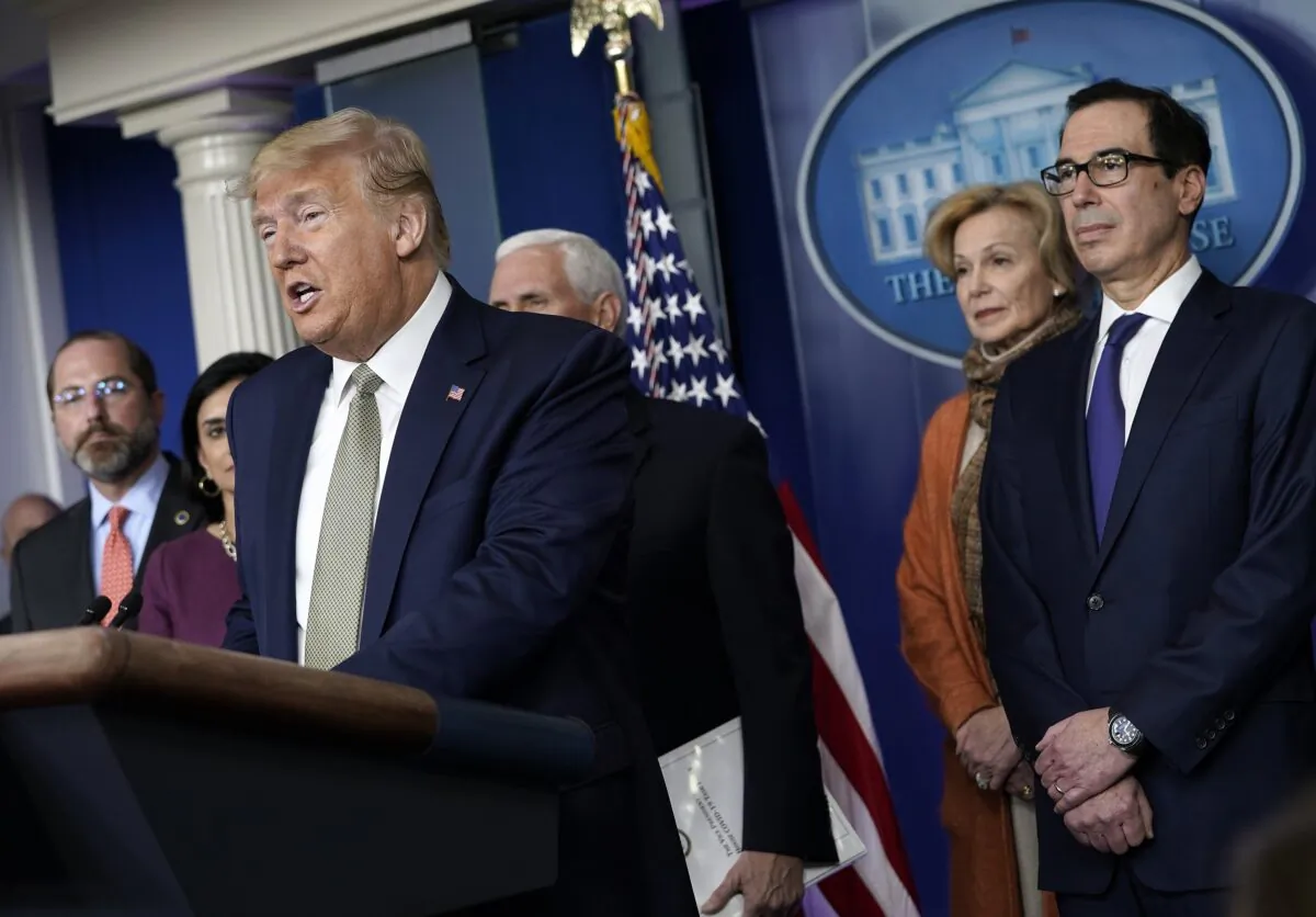 President Donald Trump speaks as administration officials listen in the press briefing room at the White House in Washington on March 17, 2020. (Drew Angerer/Getty Images)