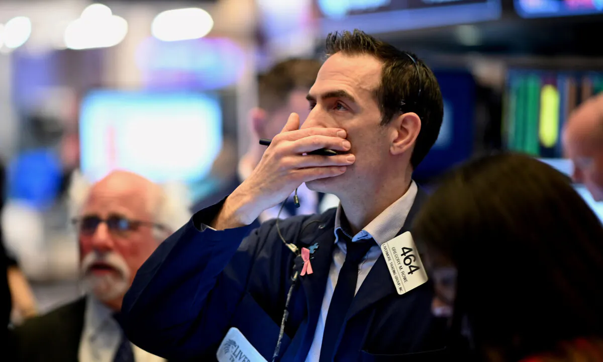 Traders work during the opening bell at the New York Stock Exchange (NYSE) at Wall Street in New York City on March 16, 2020. (Johannes Eisele/AFP via Getty Images)