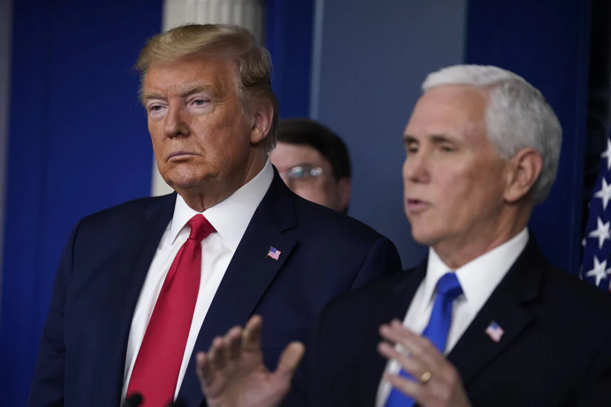 President Donald Trump listens as Vice President Mike Pence speaks during press briefing with the Coronavirus Task Force at the White House in Washington on March 18, 2020. (Evan Vucci/AP Photo)