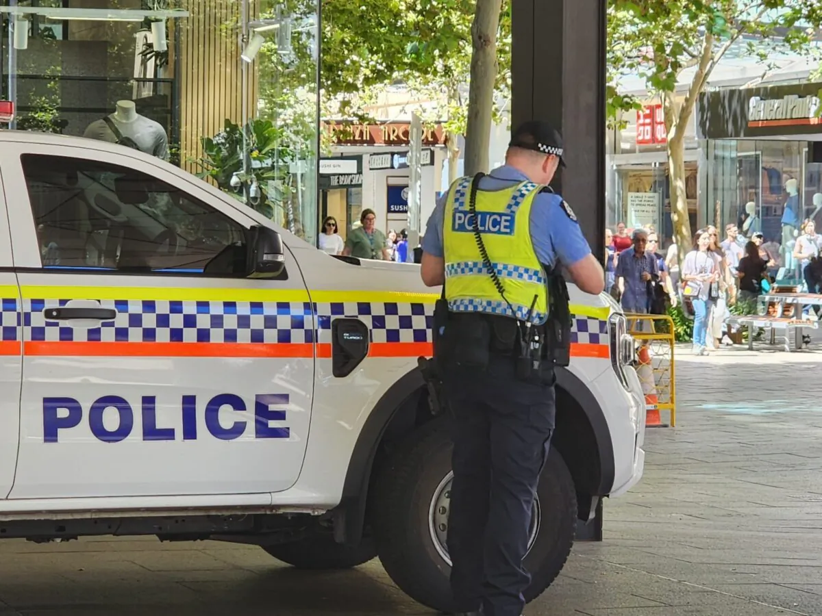 A police officer is seen next to his vehicle in the central business district of Perth, Western Australia, on March 18, 2024. (Susan Mortimer/The Epoch Times)