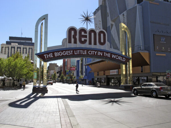 Pedestrians pass beneath the Reno