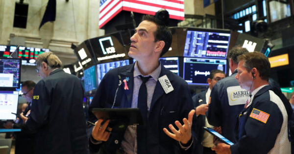 Traders work on the floor of the New York Stock Exchange
