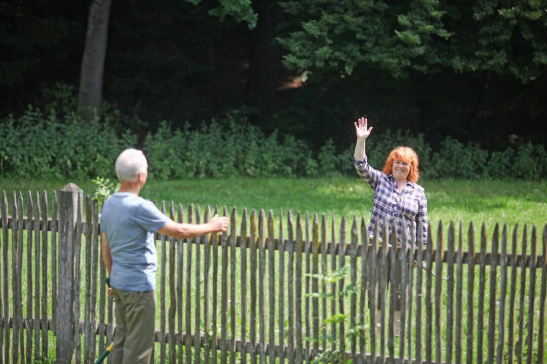 Chatting with neighbors is fine—at a distance. (Altrendo Images/Shutterstock)