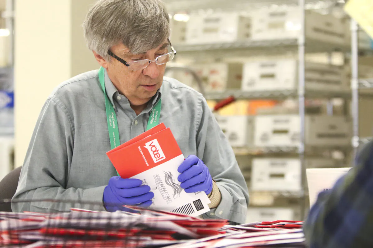An election workers sorts vote-by-mail ballots for the presidential primary at King County Elections in Renton, Washington on March 10, 2020. (JASON REDMOND/AFP via Getty Images)