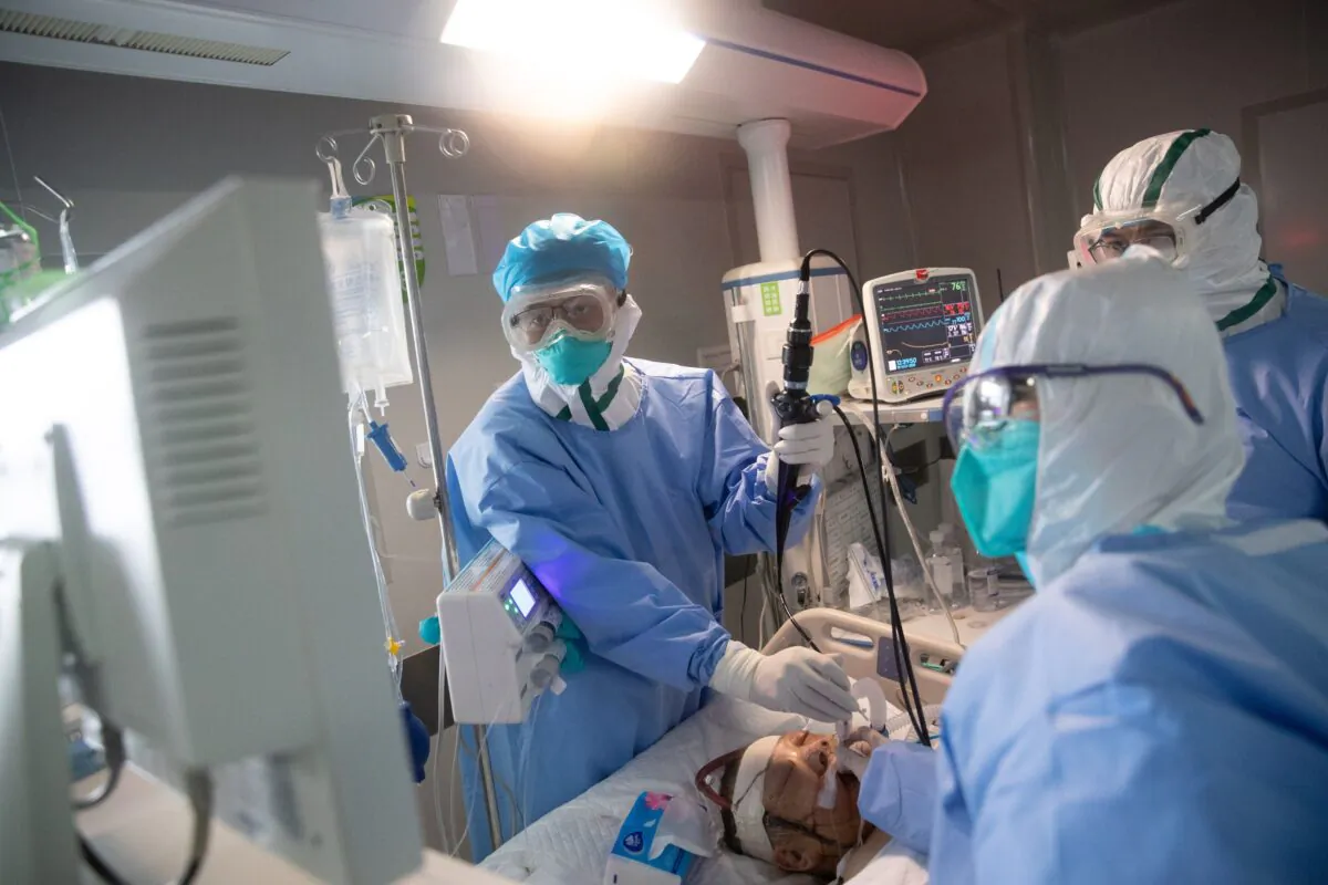 Medical staff treat COVID-19 patients at a hospital in Wuhan, China, on March 19, 2020. (STR/AFP via Getty Images)