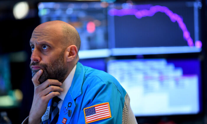 A trader works during the opening bell at the New York Stock Exchange in New York City on March 19, 2020. (Johannes Eisele/AFP via Getty Images)