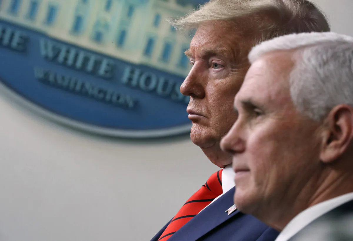 President Donald Trump and Vice President Mike Pence attend a briefing at the White House on March 19, 2020. (Chip Somodevilla/Getty Images)
