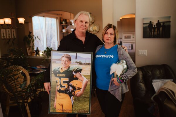 parents holding son 2