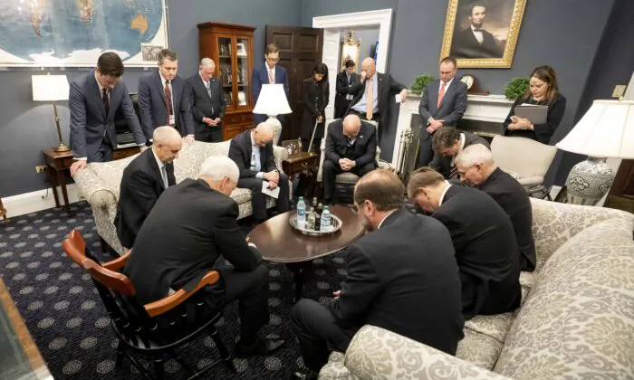 Vice President Mike Pence prays with the President’s Coronavirus Taskforce in his West Wing Office of the White House on Feb. 26, 2020. (Official White House Photo by D. Myles Cullen)