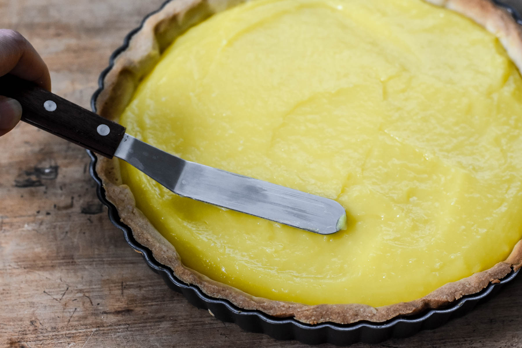 spreading the lemon custard