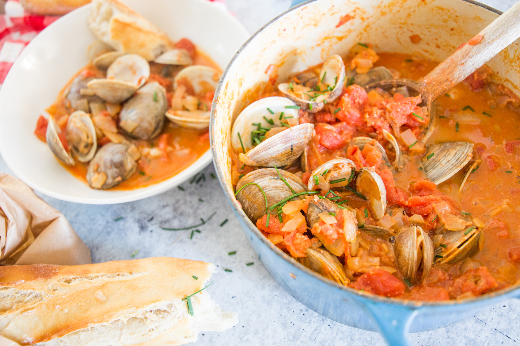 creamy tomato and chorizo clams in pot and bowl