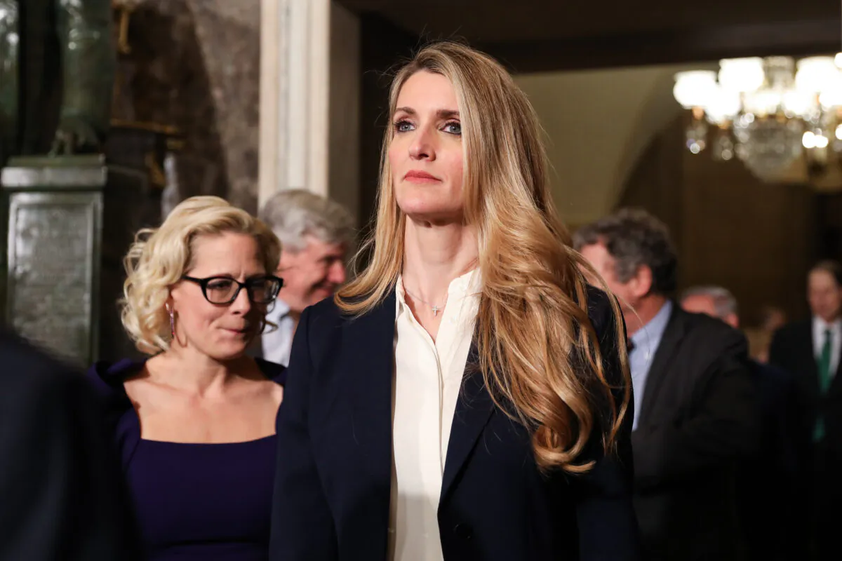Sen. Kelly Loeffler (R-Ga.) walks through Statuary Hall with other senators to the House Chamber for President Donald Trump's State of the Union address in the Capitol in Washington on Feb. 4, 2020. (Charlotte Cuthbertson/The Epoch Times)