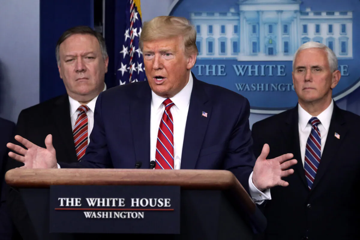 President Donald Trump speaks as Secretary of State Mike Pompeo and Vice President Mike Pence listen during a news briefing on the latest development of the coronavirus outbreak in the United States at the James Brady Press Briefing Room at the White House in Washington on March 20, 2020. (Alex Wong/Getty Images)