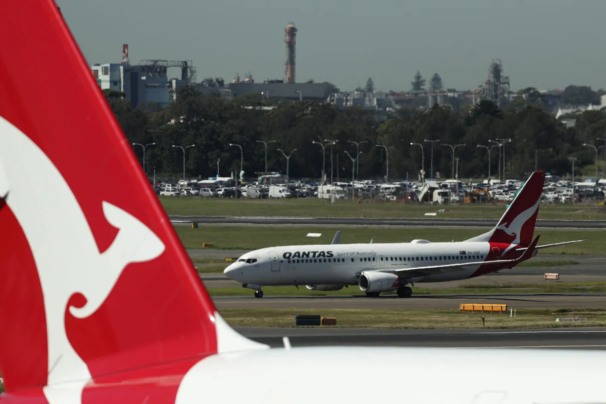 A Qantas aircraft prepares to take off from the international terminal of Sydney Airport on March 19, 2020 in Sydney, Australia. (Mark Metcalfe/Getty Images)