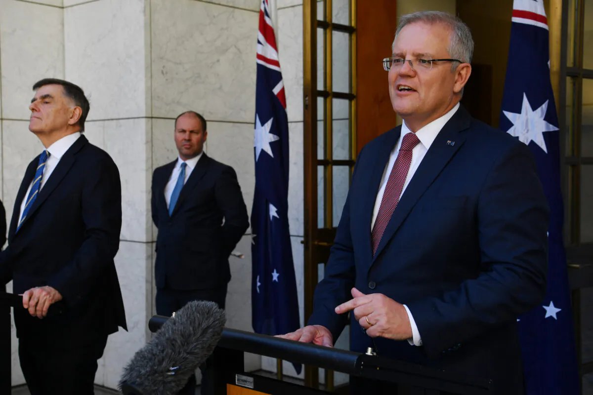 Prime Minister Scott Morrison (right), Treasurer Josh Frydenberg and Chief Medical Officer for the Australian Government Professor Brendan Murphy (left) address the media following a Cabinet meeting at Parliament House in Canberra, Australia on March 20, 2020. (Sam Mooy/Getty Images)