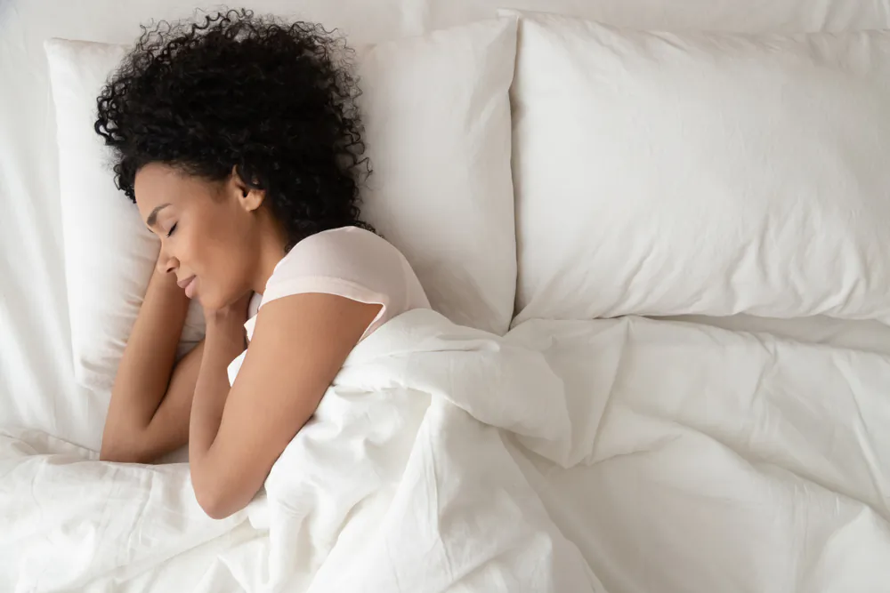 Allow yourself plenty of time to wind down, disconnect from digital devices, and enjoy deep, restorative sleep. (fizkes/Shutterstock)