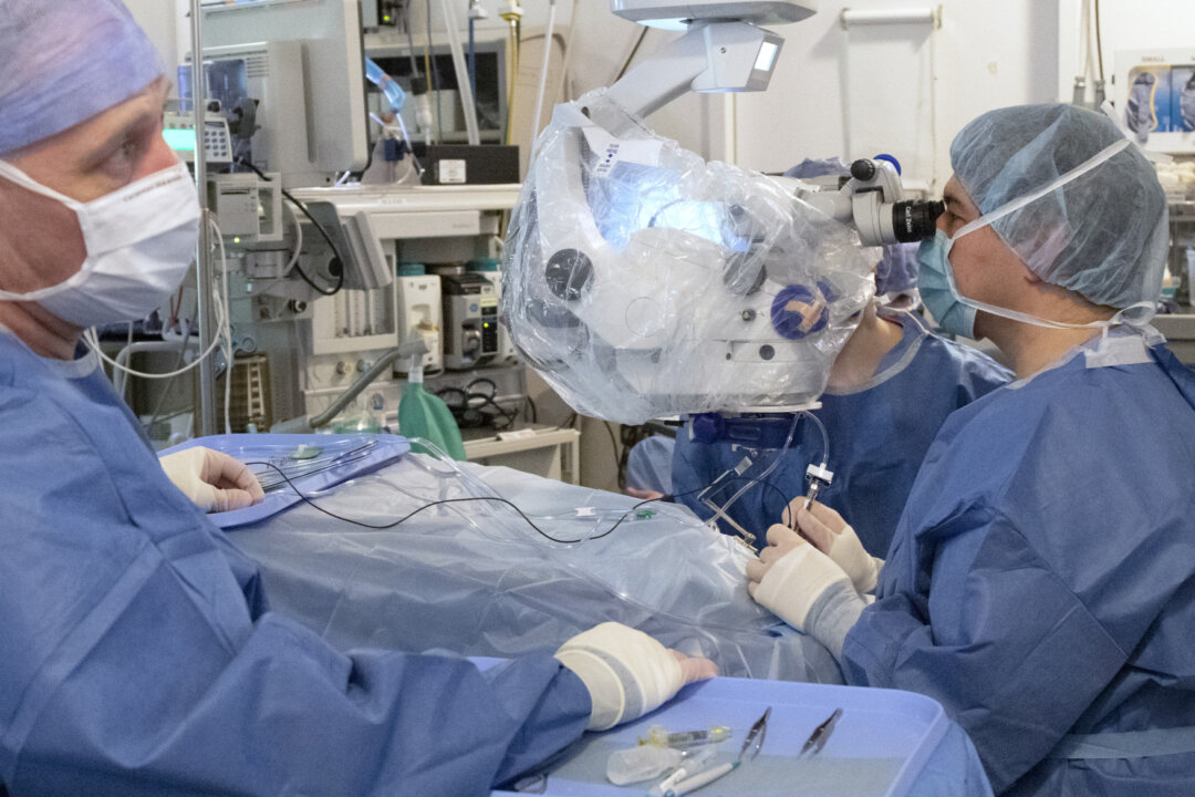 Staff members at Oregon Health & Science University's Casey Eye Institute perform the first-ever in vivo CRISPR gene edit procedure on March 21, 2020. (OHSU/Kristyna Wentz-Graff) 