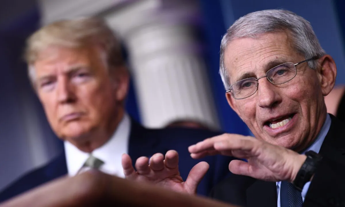 Dr. Anthony Fauci speaks as President Donald Trump listens during the daily press briefing on the Coronavirus pandemic situation at the White House in Washington on March 17, 2020. (Brendan Smialowski/AFP via Getty Images)