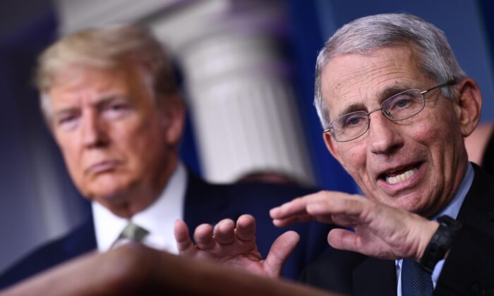 Dr. Anthony Fauci speaks as President Donald Trump listens during the daily press briefing on the Coronavirus pandemic situation at the White House in Washington on March 17, 2020. (Brendan Smialowski/AFP via Getty Images)