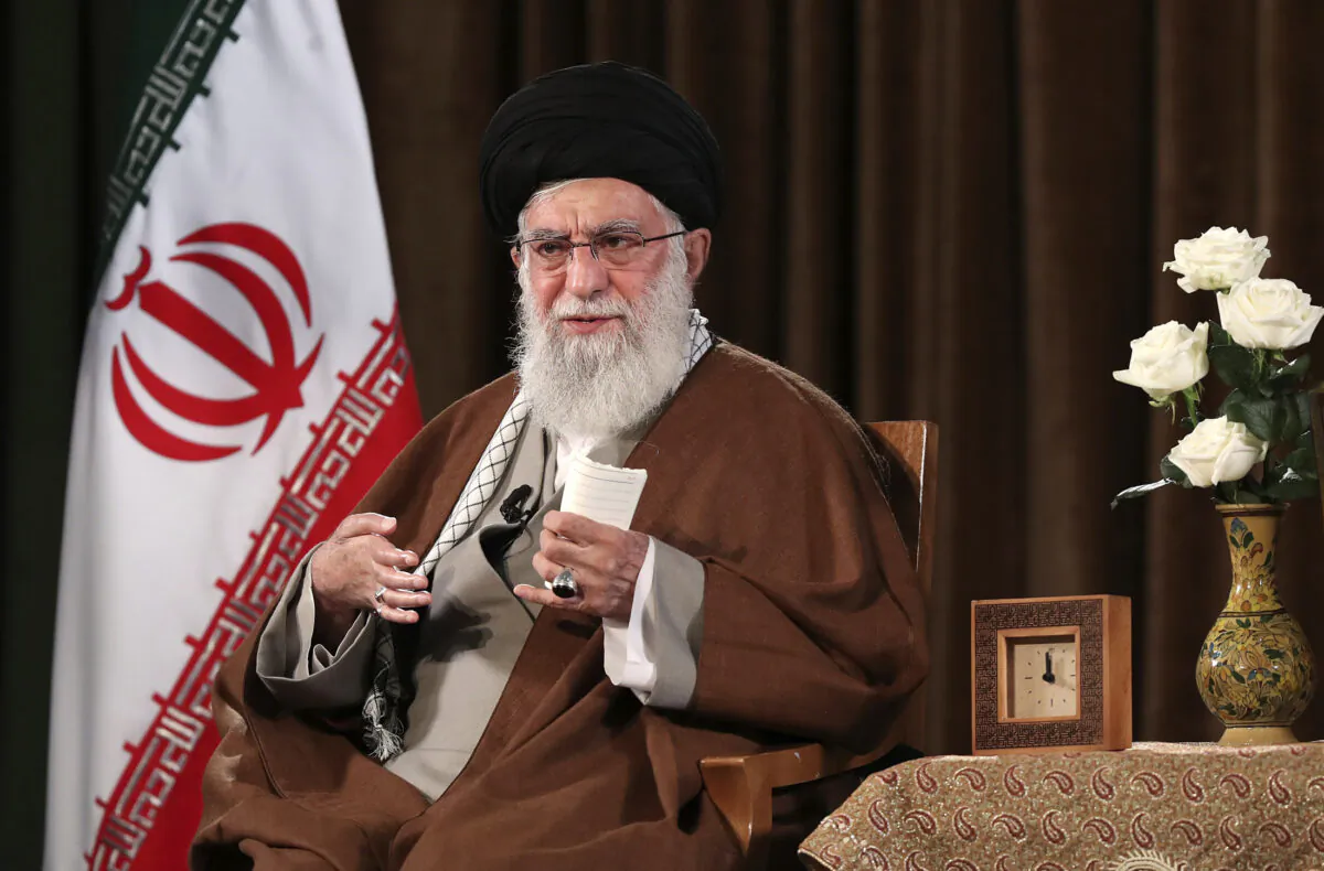 In this picture released by the official website of the office of the Iranian supreme leader, Supreme Leader Ayatollah Ali Khamenei addresses the nation on a televised speech in Tehran, Iran, on March 22, 2020. (Office of the Iranian Supreme Leader via AP)