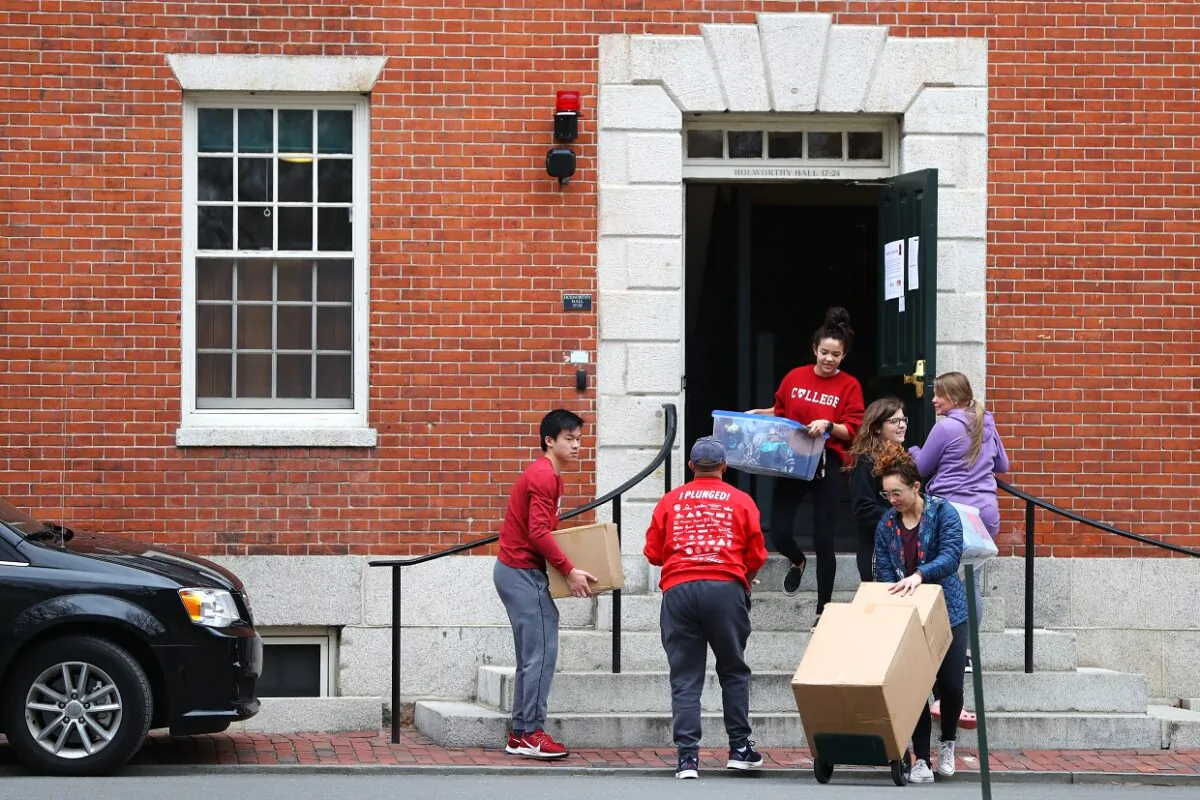 Students move out of dorm rooms on Harvard Yard on the campus of Harvard University in Cambridge, Mass. on March 12, 2020. Due to the risk from the CCP virus, all classes will be moved online for the rest of the spring semester. (Maddie Meyer/Getty Images)