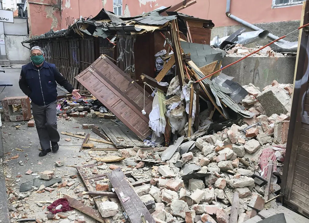A man inspects the damage caused by an earthquake in Zagreb, Croatia, on March 22, 2020. (Filip Horvat/AP Photo)