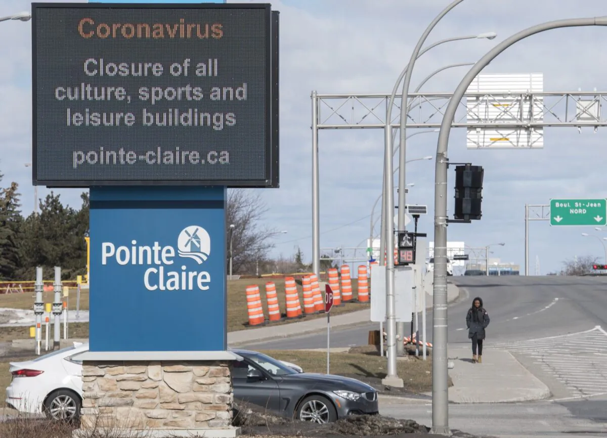 An information sign in Pointe-Claire, Montreal, on March 14, 2020, advising people of cancelled events due to the CCP virus pandemic. (The Canadian Press/Graham Hughes)
