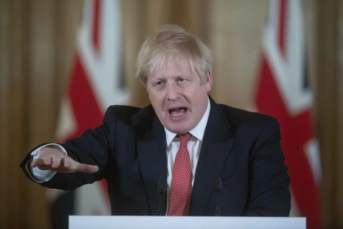 British Prime Minister Boris Johnson gestures as he speaks during a daily press conference at 10 Downing Street on March 20, 2020 in London, England. (Julian Simmonds - WPA Pool/Getty Images)