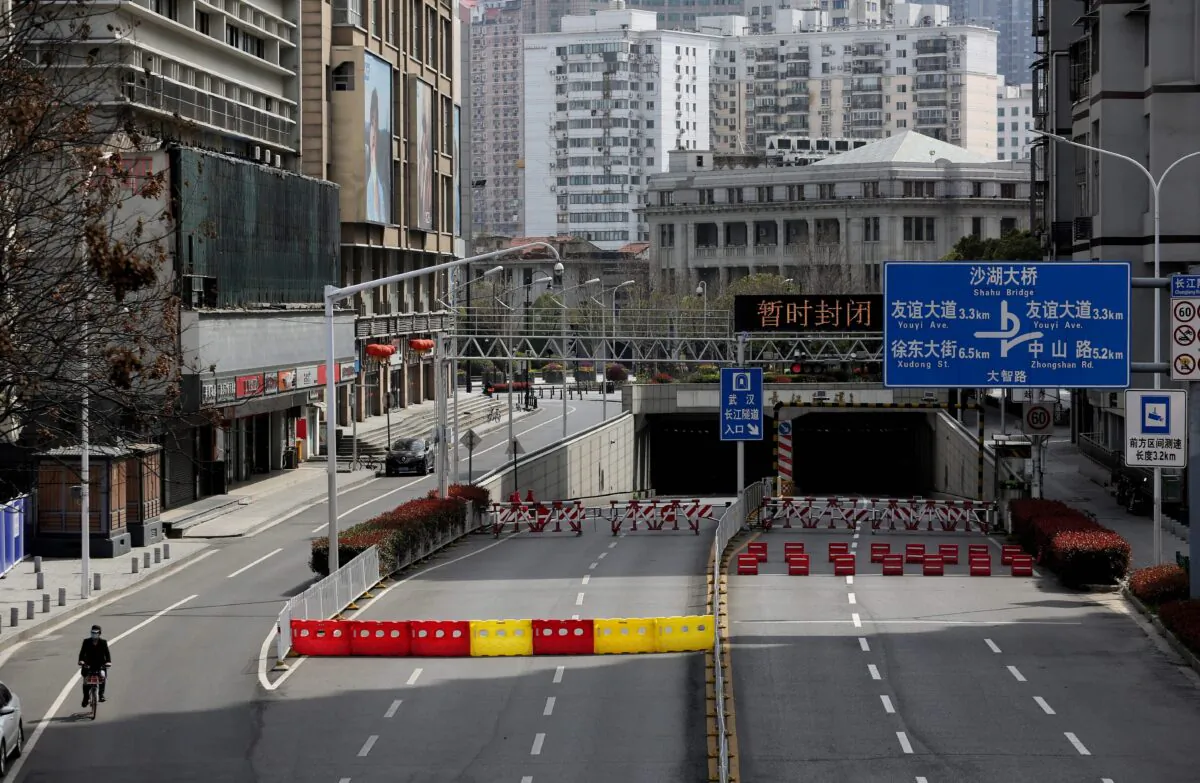 Barriers set up to block off a street in Wuhan, China, on March 15, 2020. The normally bustling city in central China is the epicentre of COVID-19 and a symbol of the Chinese economy’s shutdown in the first quarter of 2020. (STR/AFP via Getty Images)