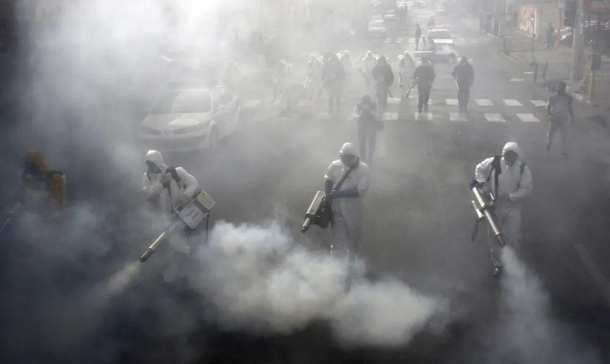 Iranian Firefighters disinfect streets in the capital Tehran in a bid to halt the wild spread of coronavirus on March 13 2020. (AFP via Getty Images)